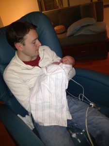 Daddy finally getting to hold his baby girl