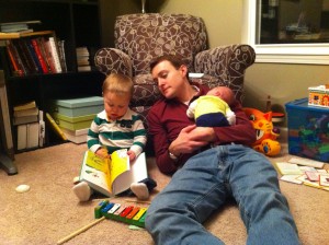 Daddy cuddling with his kids.