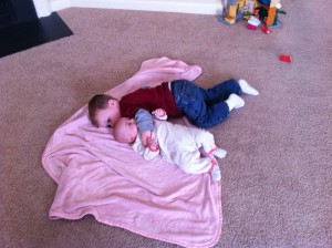 Ethan loves cuddling his little sister.