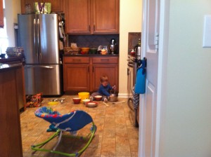 "Helping" me unload the dishwasher - aka making a picnic.