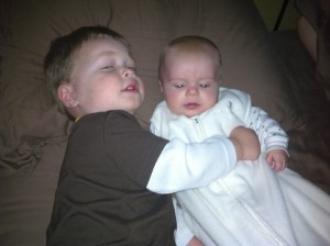 Snuggling in Mommy and Daddy's bed this morning when we all woke up.