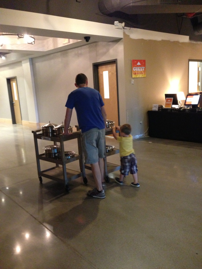 Helping push carts for communion at church
