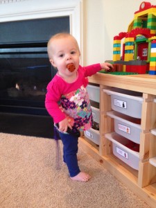 She has figured out how to make a whistling noise with these Legos.