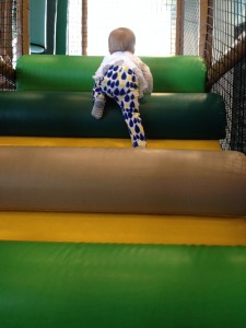 Climbing up the big kid equipment at the Park at church.