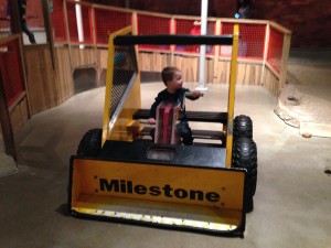 Riding the bulldozer at the children's museum.