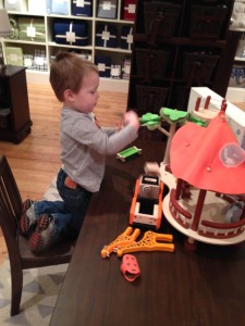 Playing at Pottery Barn Kids- one of his favorite adventures.