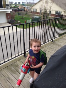 His new favorite toy - his leaf blower (that he converted to a backpack leaf blower).