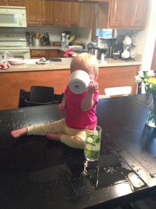Helping herself to Mommy's coffee.