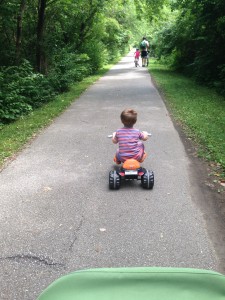 Riding his tricycle like a boss.  He can finally reach the pedals!