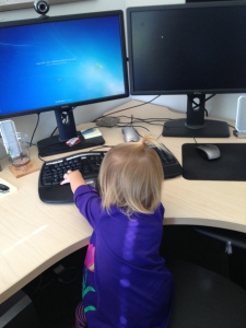 Visiting daddy at work - she is a natural.