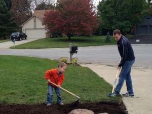 Helping spread mulch with Daddy.  He loves to help with whatever we are doing.