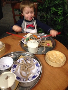 Preparing a meal in the China exhibit at the Childrens Museum.