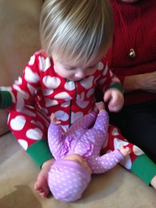 Playing with her new baby doll.