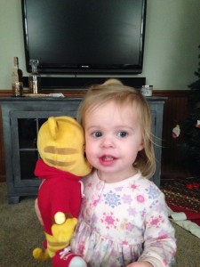Her favorite birthday present - a Daniel Tiger doll.